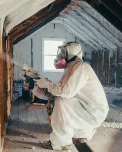 Mammoth Home Renovations insulation installer installing spay foam insulation in an attic